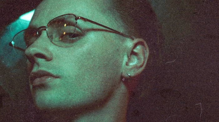 Artist Puma Blue wearing glasses and a silver earring